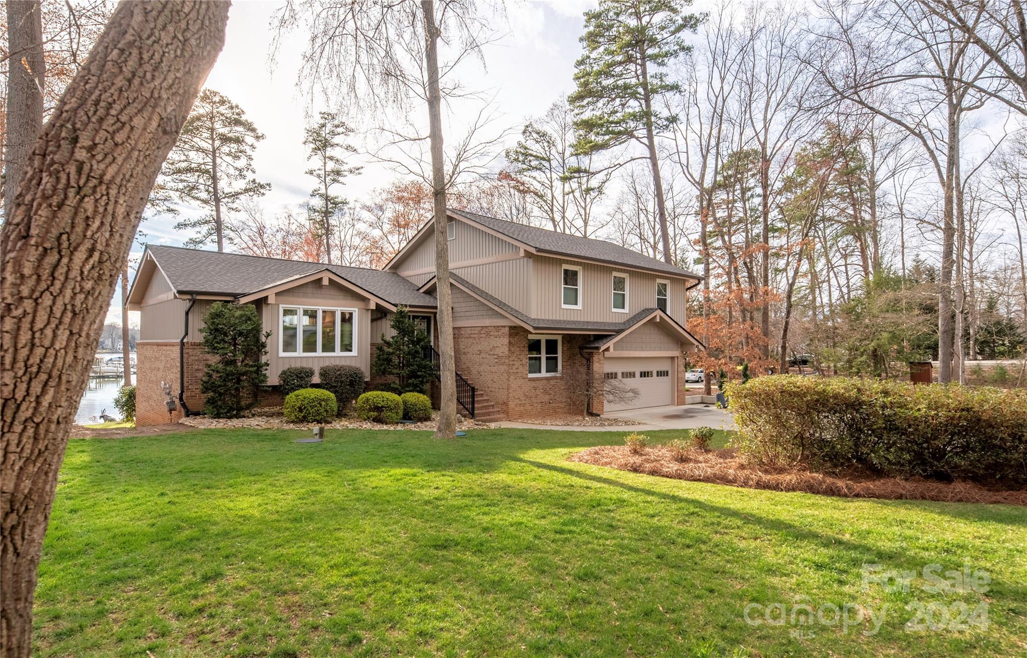 21525 Sandy Cove Road Cornelius, NC 28031 - Photo 28 of 35 a front view of a house with garden