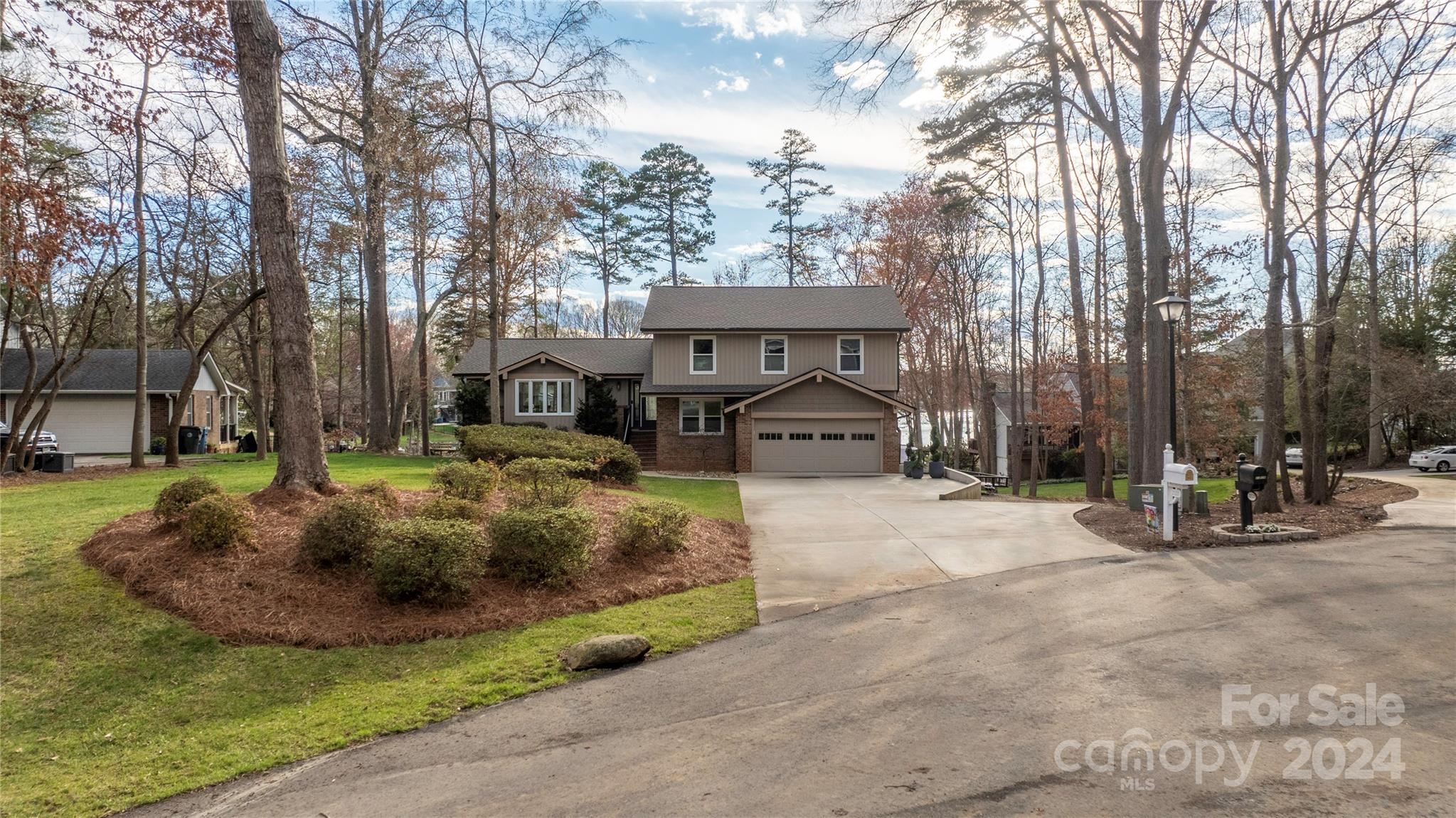 21525 Sandy Cove Road Cornelius, NC 28031 - Photo 29 of 35 a view of a house with backyard and sitting area