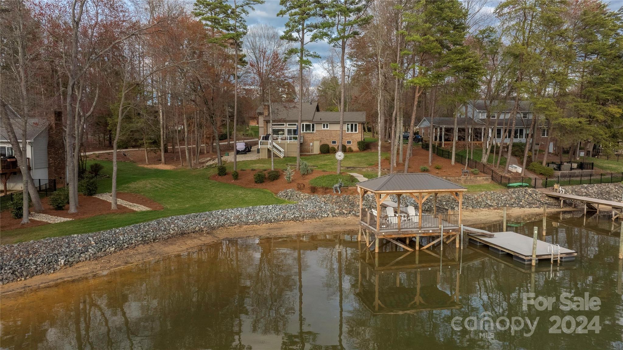 21525 Sandy Cove Road Cornelius, NC 28031 - Photo 33 of 35 a swimming pool with outdoor seating and yard