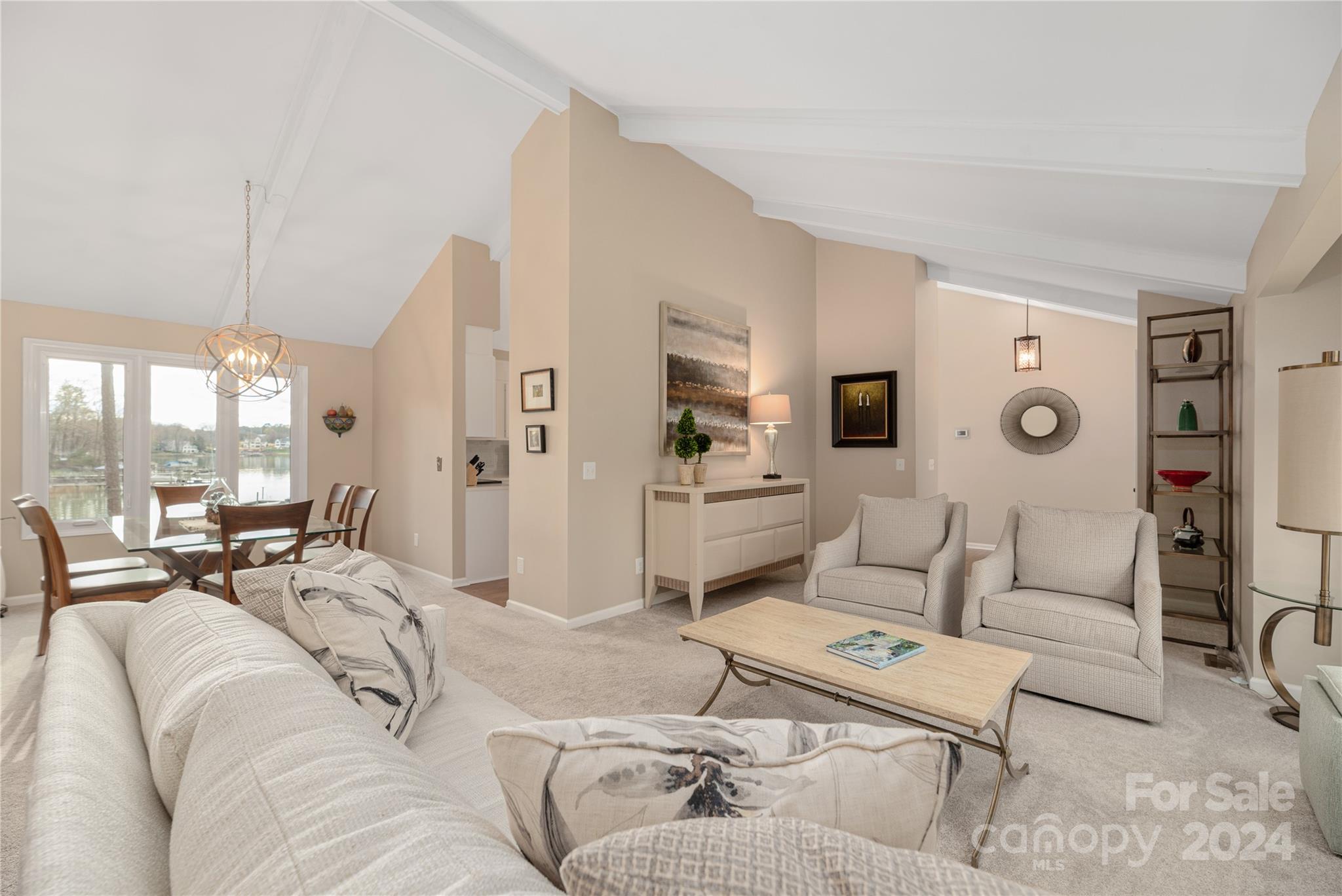 21525 Sandy Cove Road Cornelius, NC 28031 - Photo 8 of 35 a living room with furniture and a large window