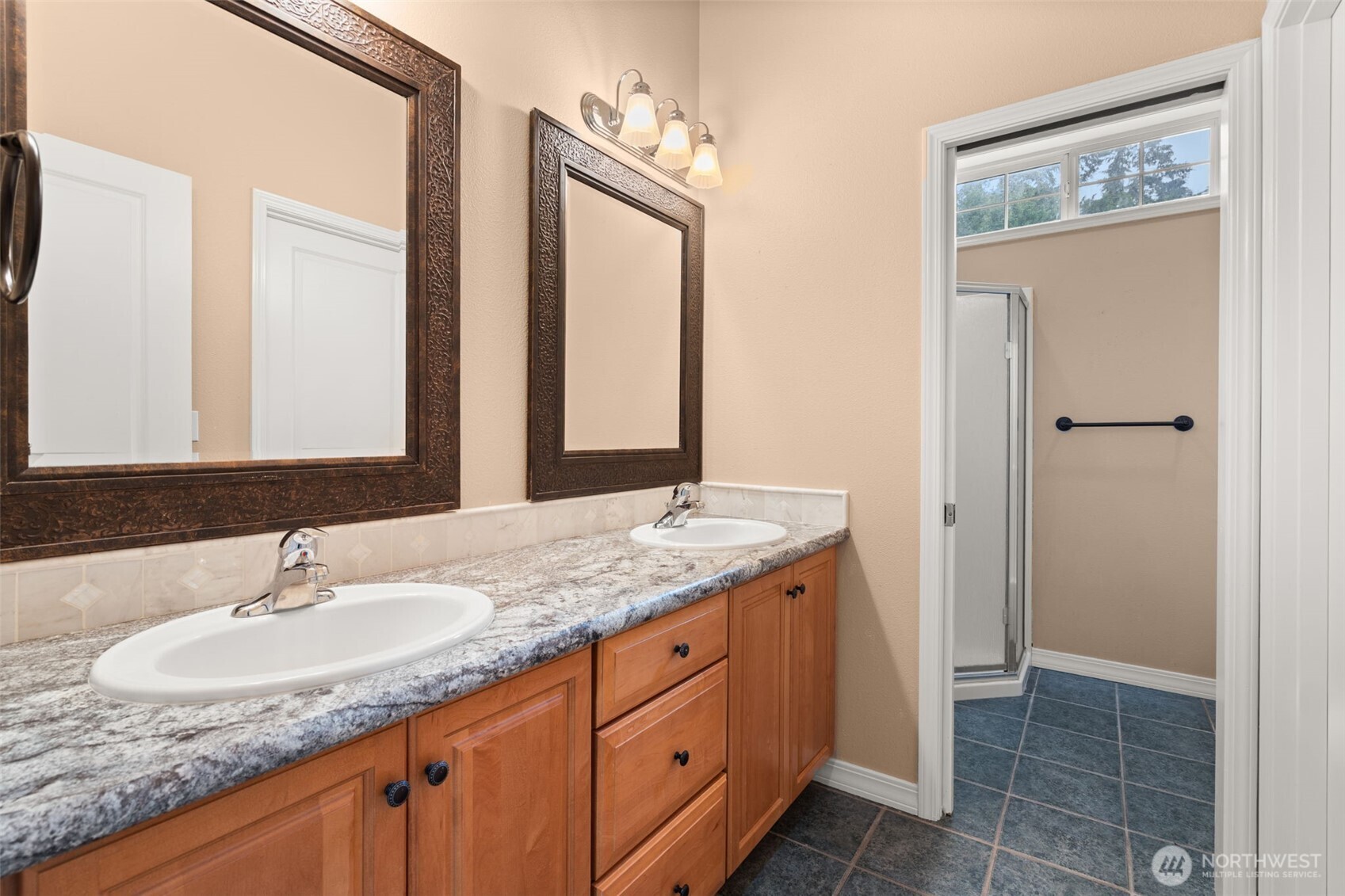 9609 346th Street South Roy, WA 98580 - Photo 18 of 37 a bathroom with a granite countertop sink and a mirror