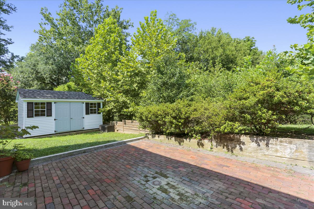 8602 Grubb Road Chevy Chase, MD 20815 - Photo 60 of 106 Brick patio and storage shed