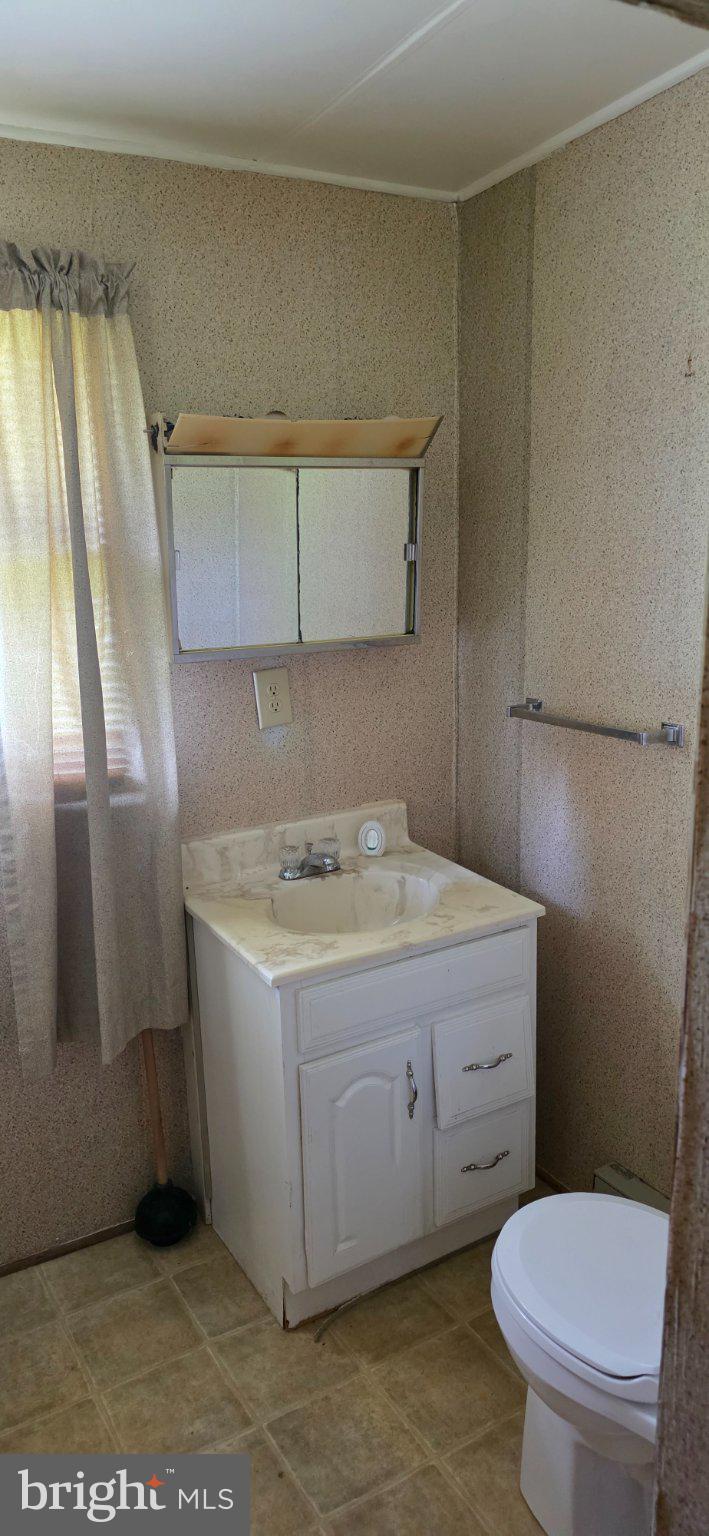 9000 Corner Road Hancock, MD 21750 - Photo 8 of 13 Cozy bathroom with natural light.