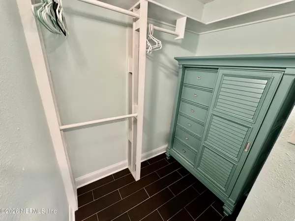 a bathroom with a shower and a sink