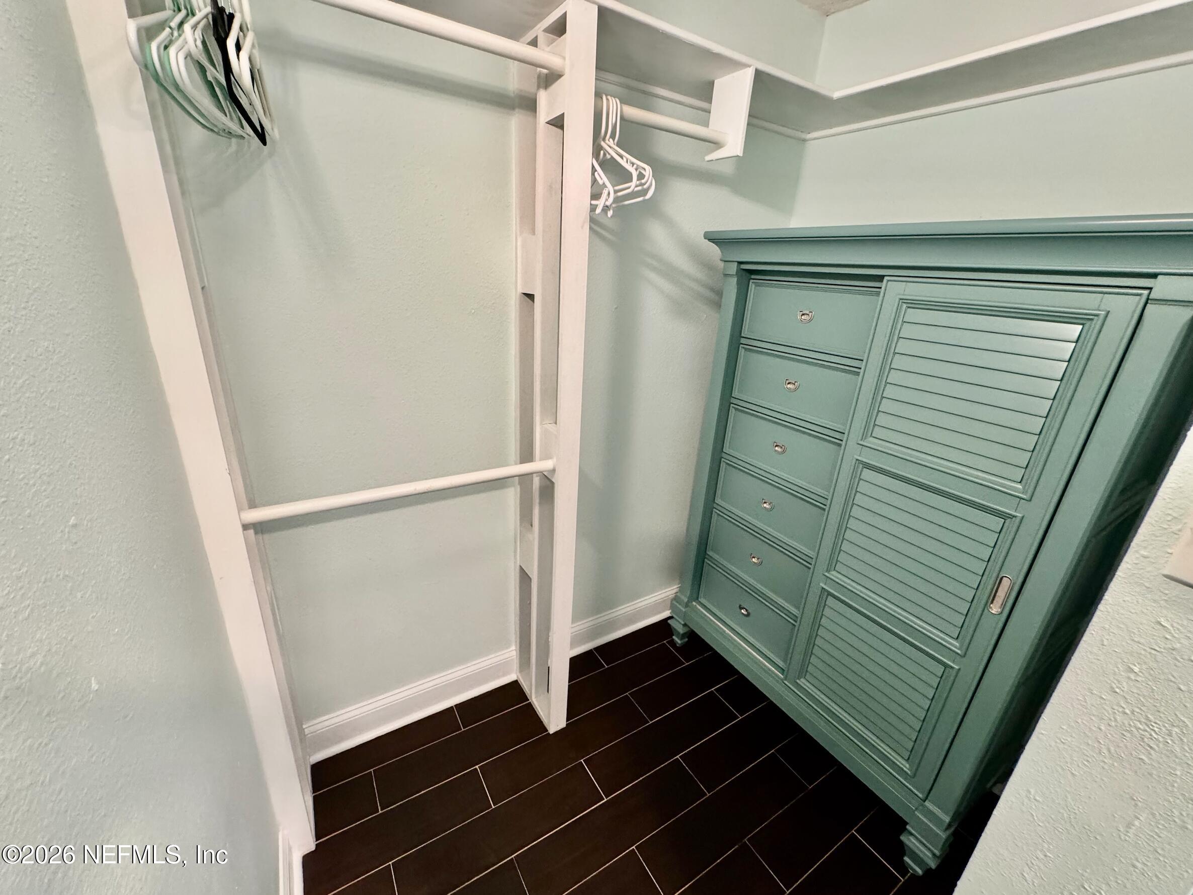 8711 Blind Pass Road, Unit 208A St. Petersburg, FL 33706 - Photo 19 of 21 a bathroom with a shower and a sink