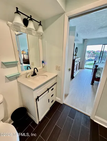 a bathroom with a sink and a mirror