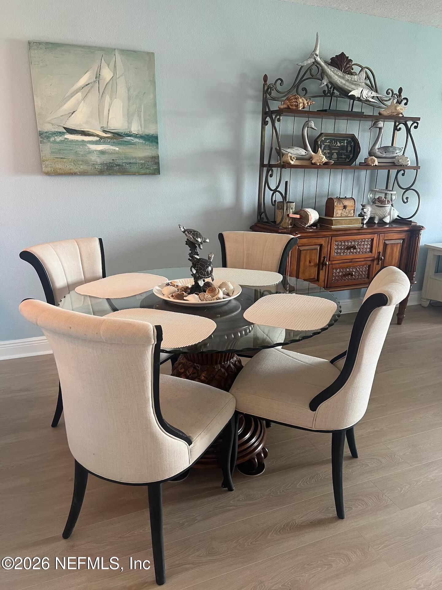 8711 Blind Pass Road, Unit 208A St. Petersburg, FL 33706 - Photo 21 of 21 a view of a dining room with furniture