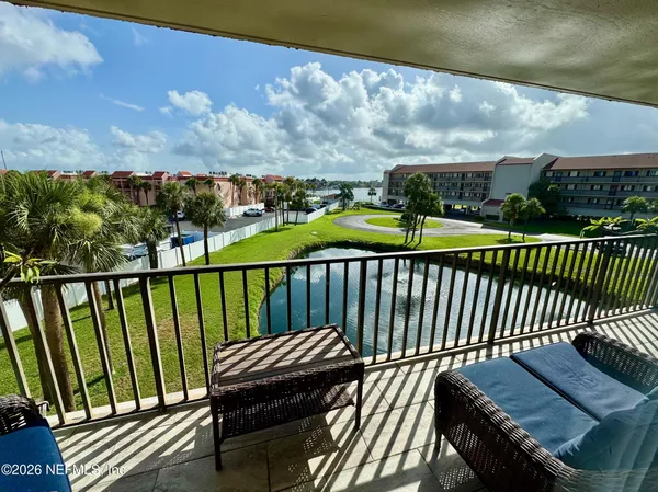 a view of a balcony with wooden floor