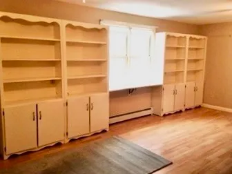 an empty room with cabinet