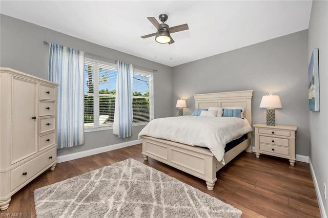 a bedroom with furniture and wooden floor