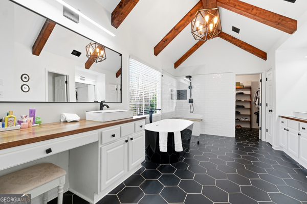 7125 Compton Circle Cumming, GA 30040 - Photo 11 of 40 a hall with a sink cabinets and a wooden floor