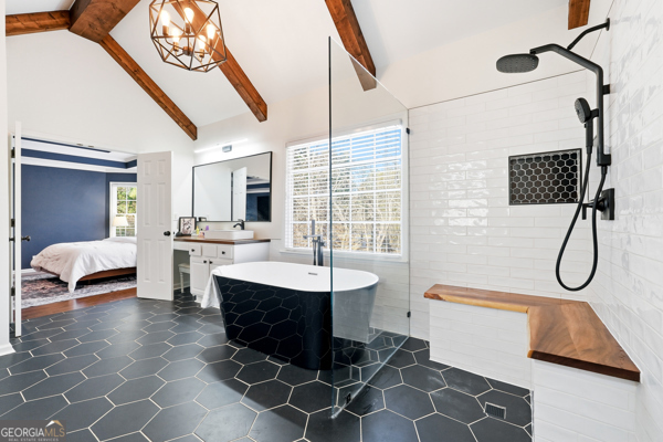 7125 Compton Circle Cumming, GA 30040 - Photo 12 of 40 a bathroom with a double vanity sink a toilet a mirror and bathtub
