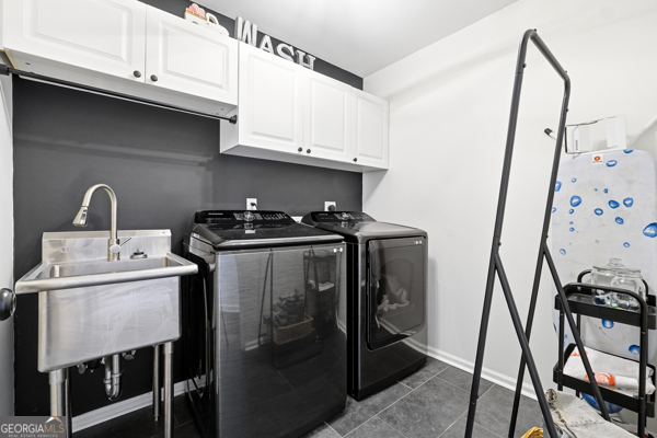 7125 Compton Circle Cumming, GA 30040 - Photo 13 of 40 a utility room with dryer and washer