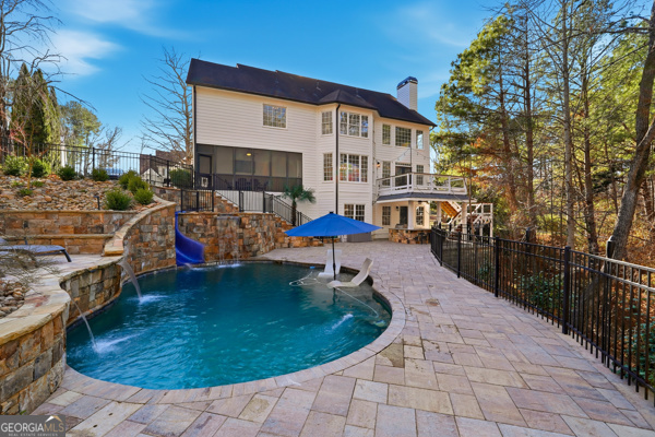 7125 Compton Circle Cumming, GA 30040 - Photo 16 of 40 a view of a house with backyard porch and sitting area