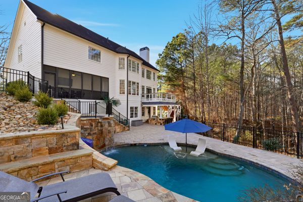 7125 Compton Circle Cumming, GA 30040 - Photo 17 of 40 a swimming pool with outdoor seating water slide and yard