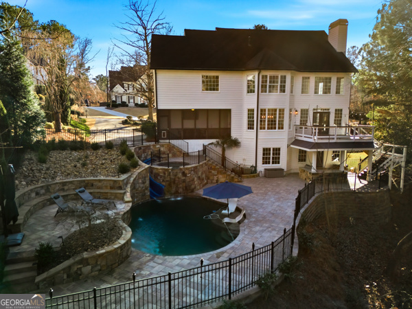 7125 Compton Circle Cumming, GA 30040 - Photo 20 of 40 a view of a house with backyard and sitting area