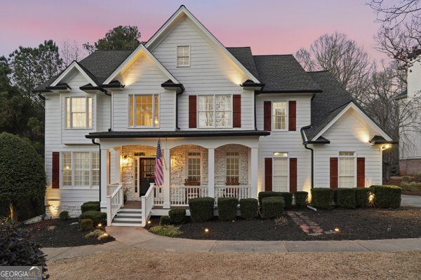 7125 Compton Circle Cumming, GA 30040 - Photo 2 of 40 front view of a house with a yard