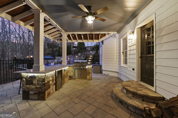 7125 Compton Circle Cumming, GA 30040 - Photo 24 of 40 a building outdoor space with patio furniture and potted plants