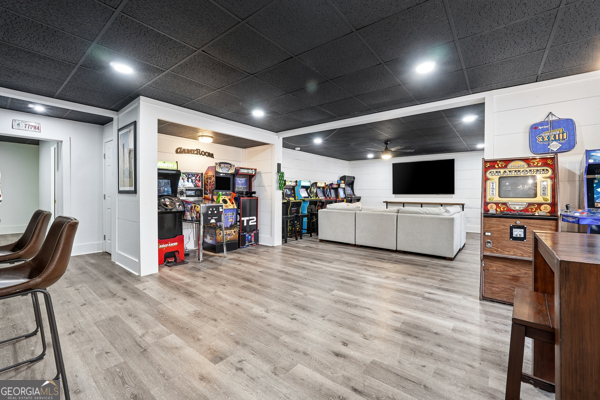 7125 Compton Circle Cumming, GA 30040 - Photo 27 of 40 a view of a room with gym equipment and a flat screen tv