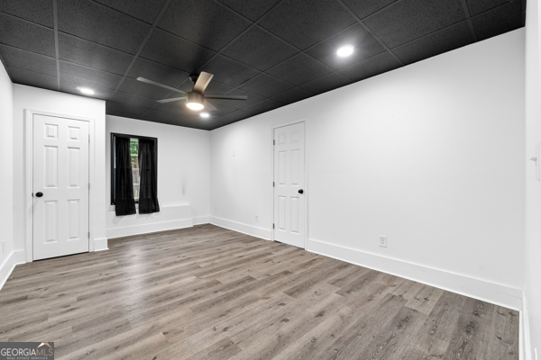 7125 Compton Circle Cumming, GA 30040 - Photo 29 of 40 an empty room with wooden floor and windows