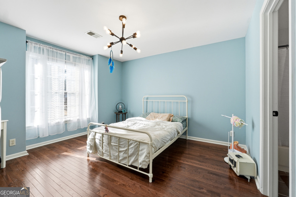 7125 Compton Circle Cumming, GA 30040 - Photo 32 of 40 a bedroom with a bed and a window