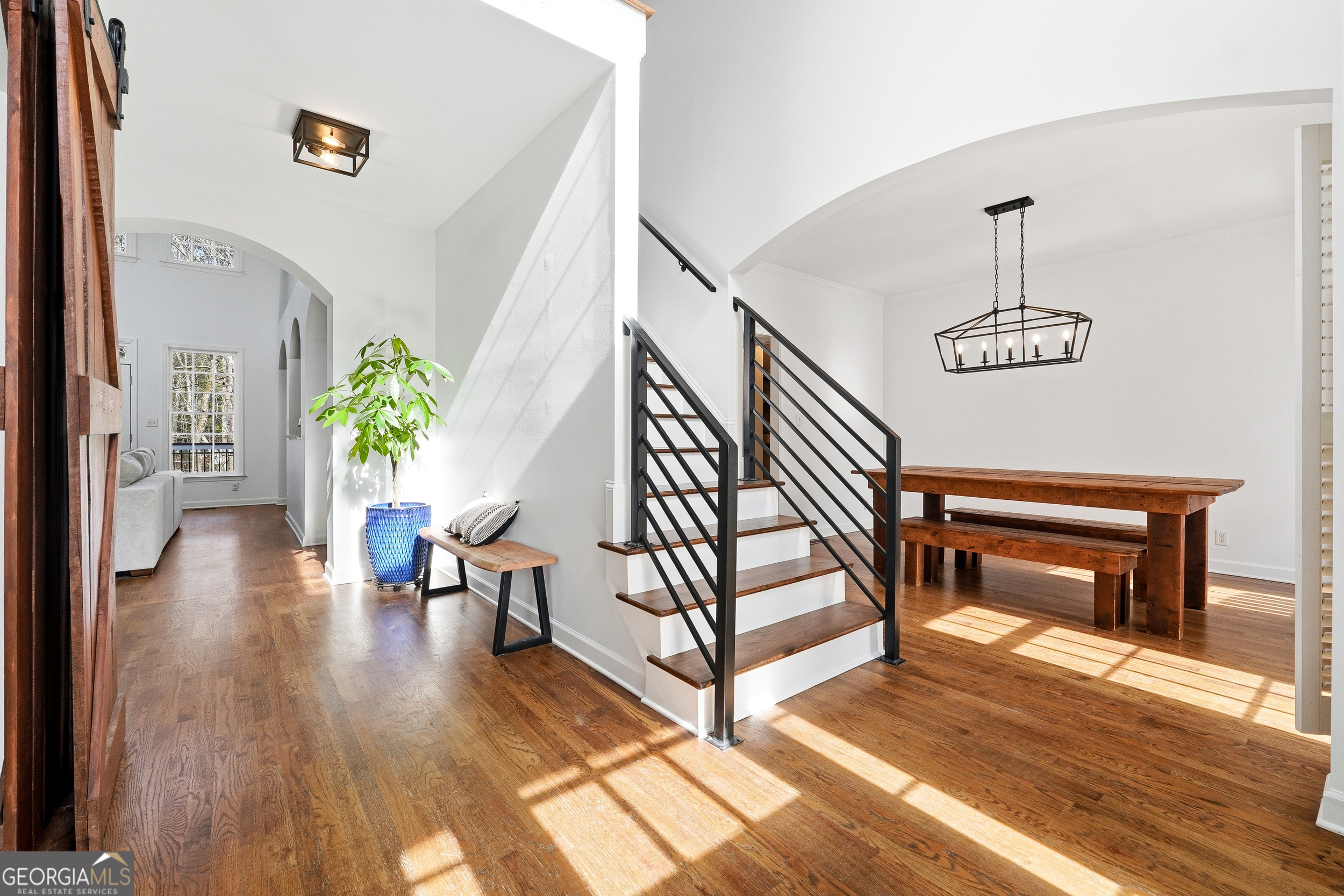 7125 Compton Circle Cumming, GA 30040 - Photo 7 of 40 a view of a hallway with wooden floor and furniture