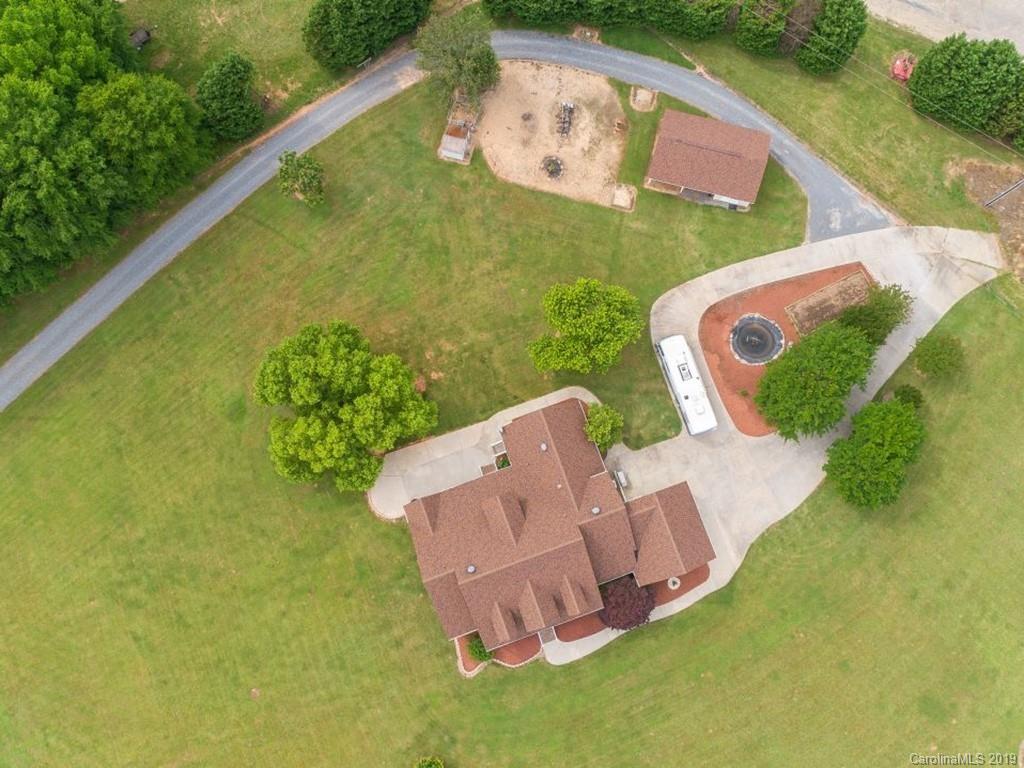 140 Springlake Road York, SC 29745 - Photo 2 of 24 an aerial view of a house with garden space and a lake view