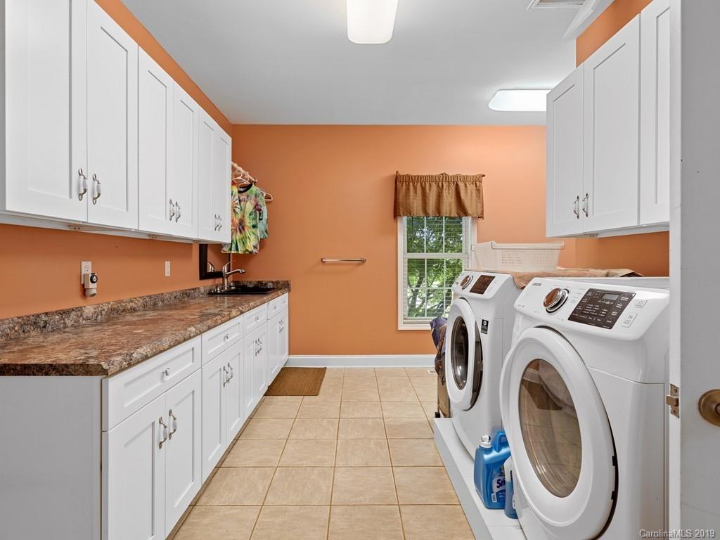 140 Springlake Road York, SC 29745 - Photo 12 of 24 a utility room with sink dryer and washer