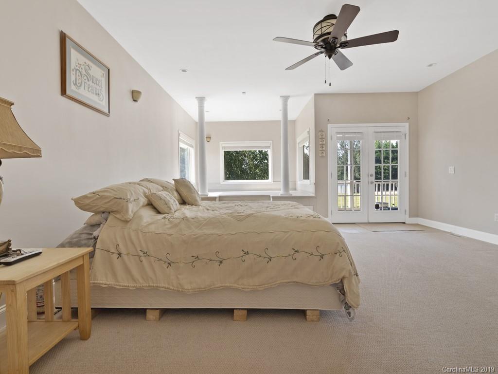 140 Springlake Road York, SC 29745 - Photo 13 of 24 a spacious bedroom with a bed dresser and a window