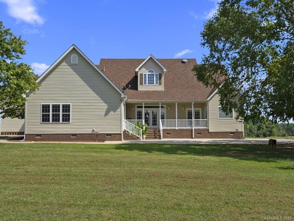 140 Springlake Road York, SC 29745 - Photo 21 of 24 a front view of a house with a garden and yard