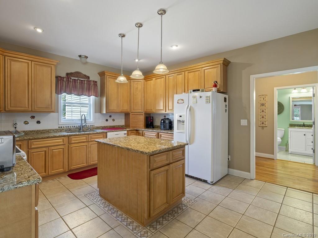 140 Springlake Road York, SC 29745 - Photo 9 of 24 a kitchen with granite countertop cabinets and stainless steel appliances
