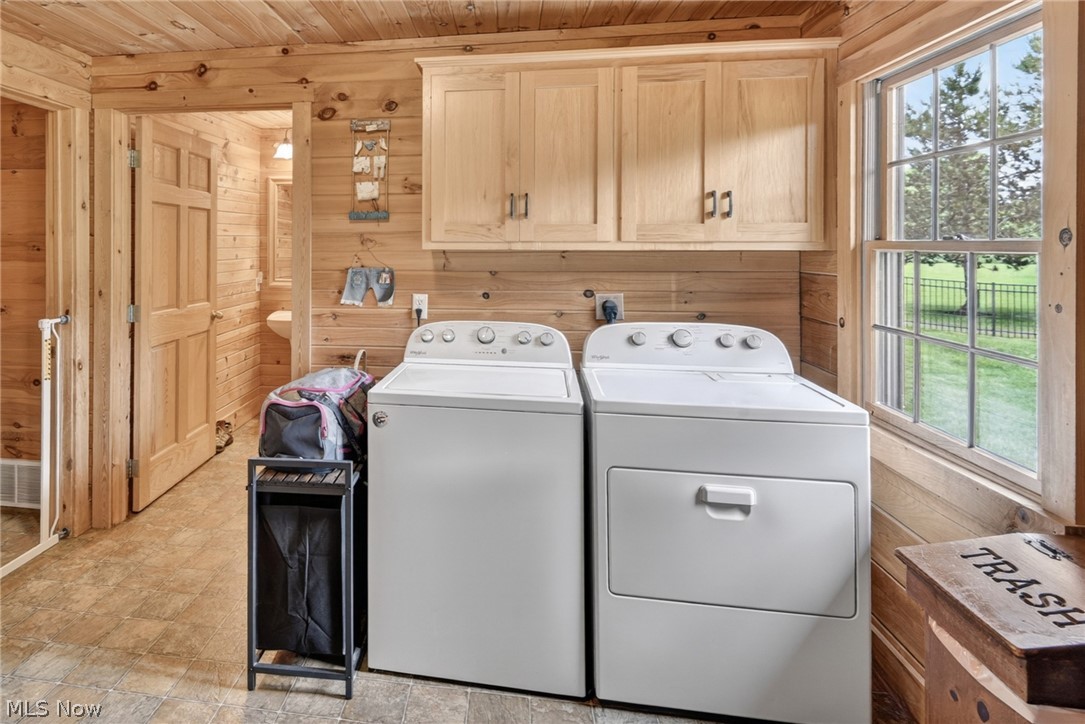 16727 Pitts Road Wellington, OH 44090 - Photo 12 of 50 Laundry with hickory cabinets matching kitchen with access to outside covered porch
