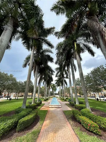 a view of a yard with palm trees