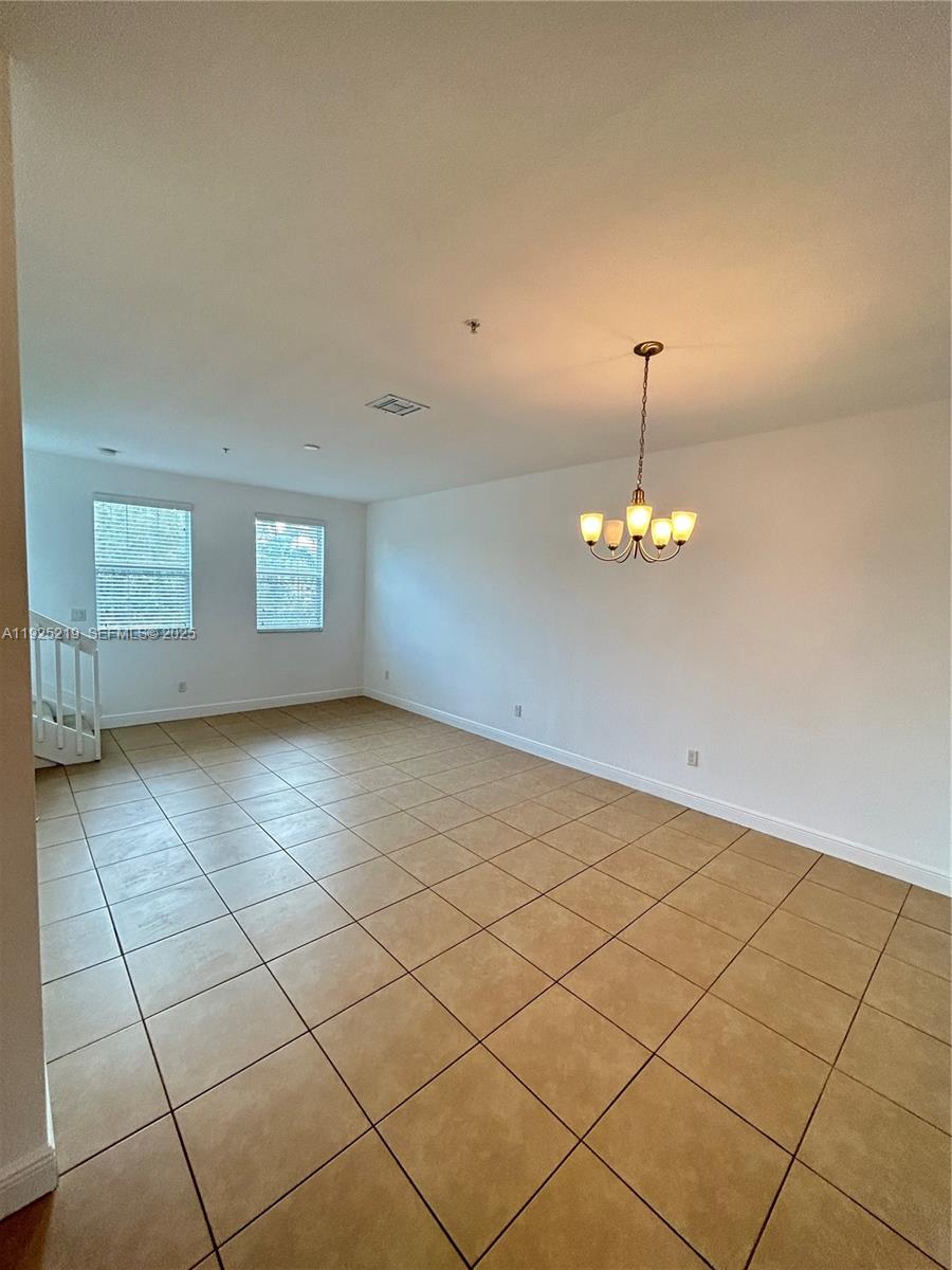 Cobblestone Pembroke Pines, FL 33027 - Photo 6 of 16 a view of an empty room with a window