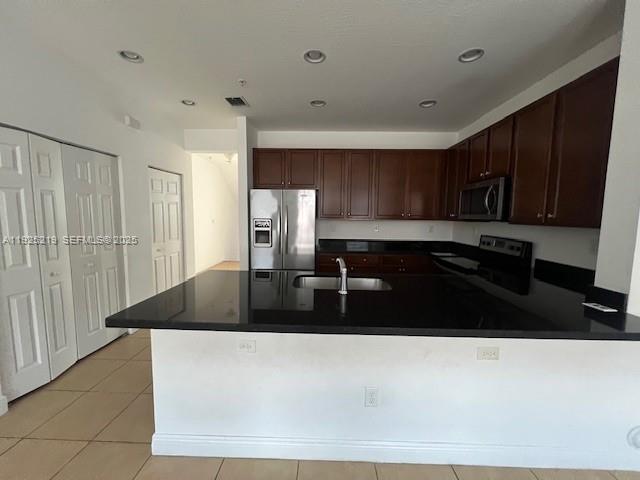 Cobblestone Pembroke Pines, FL 33027 - Photo 10 of 16 a kitchen with a sink and cabinets