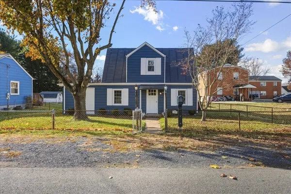 a front view of a house with a swimming pool