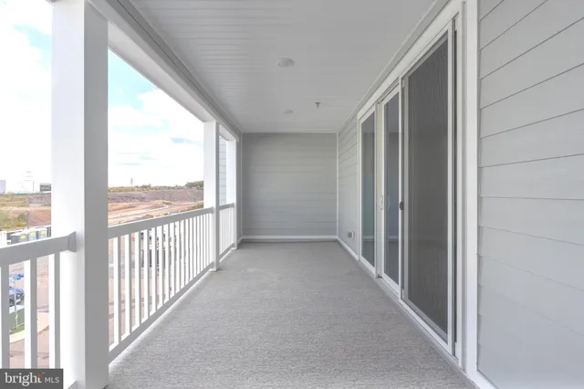 a view of a hallway with windows