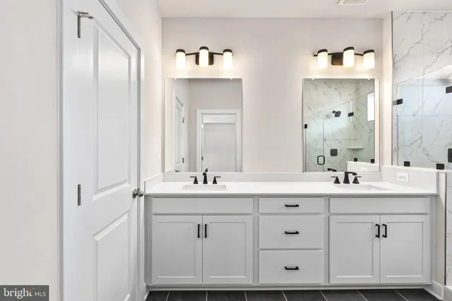 a bathroom with double sink and mirror