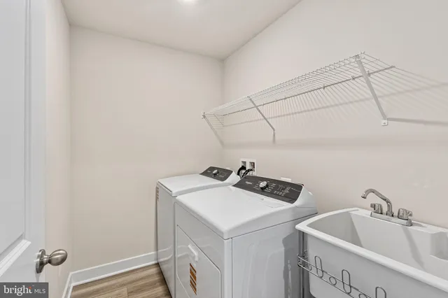 a bathroom with a sink and cabinets