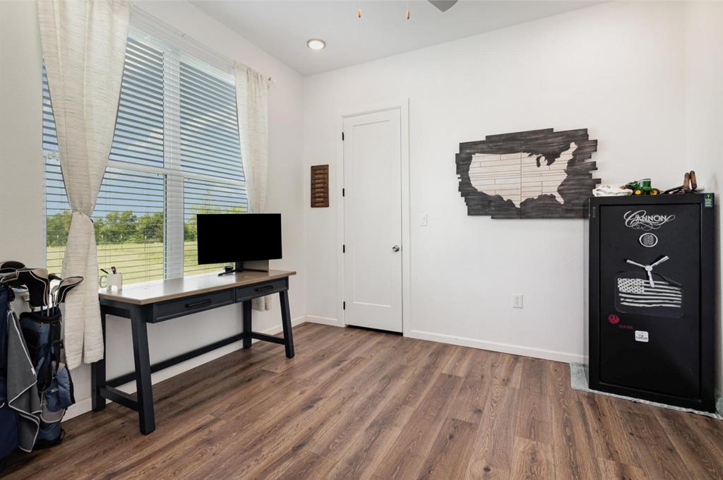 601 Gin Road Ennis, TX 75119 - Photo 12 of 33 a view of a workspace with furniture and a window
