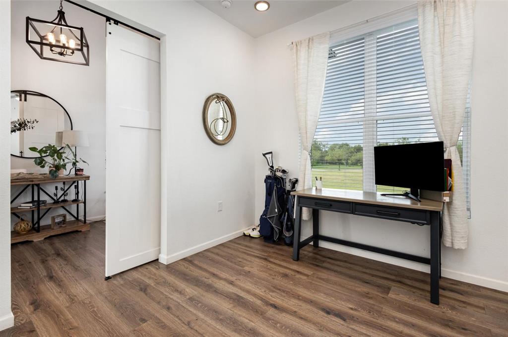 601 Gin Road Ennis, TX 75119 - Photo 13 of 33 a view of a livingroom with furniture and a flat screen tv