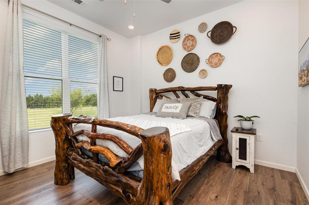 601 Gin Road Ennis, TX 75119 - Photo 18 of 33 a bedroom with a bed and a window