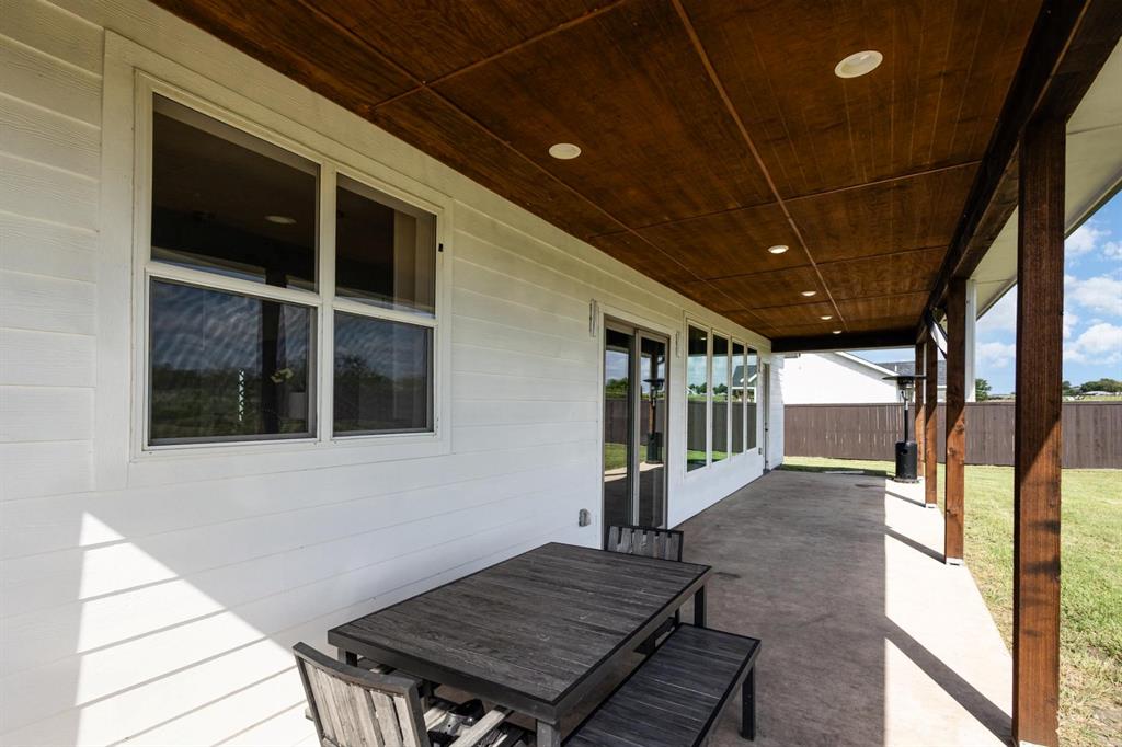 601 Gin Road Ennis, TX 75119 - Photo 23 of 33 a view of a porch with furniture and a gate