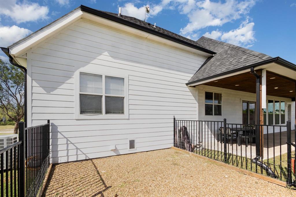 601 Gin Road Ennis, TX 75119 - Photo 24 of 33 a view of a house with a patio
