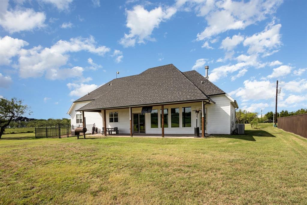 601 Gin Road Ennis, TX 75119 - Photo 25 of 33 a front view of house with yard