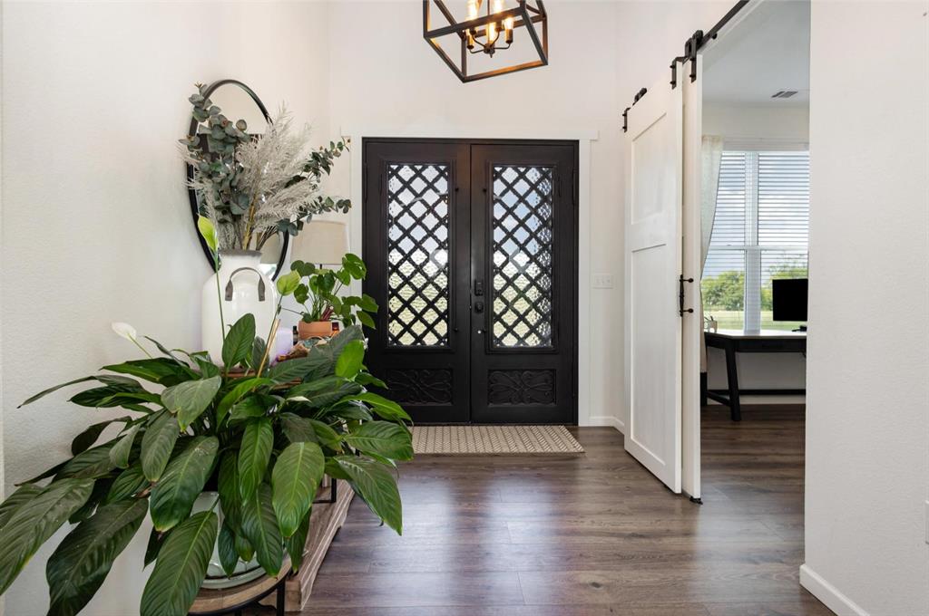 601 Gin Road Ennis, TX 75119 - Photo 3 of 33 a view of entryway with wooden floor