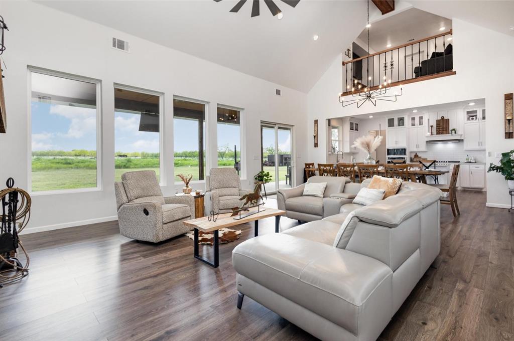 601 Gin Road Ennis, TX 75119 - Photo 4 of 33 a living room with furniture and a large window