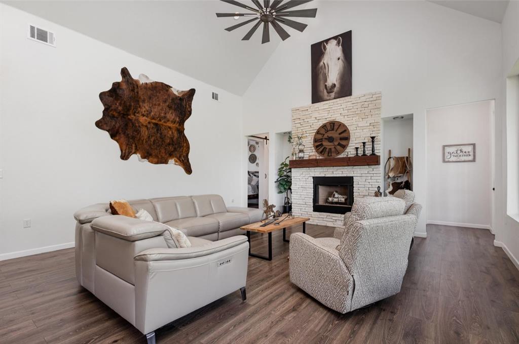601 Gin Road Ennis, TX 75119 - Photo 7 of 33 a living room with furniture and a fireplace