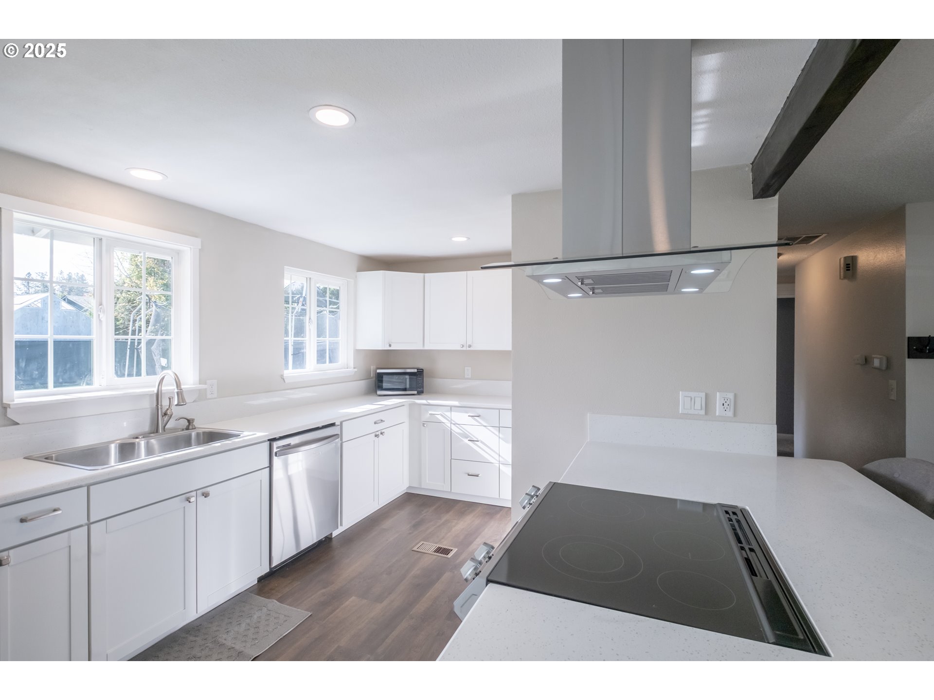 562 Elm Street Jefferson, OR 97352 - Photo 4 of 16 a open kitchen with a sink dishwasher and white cabinets