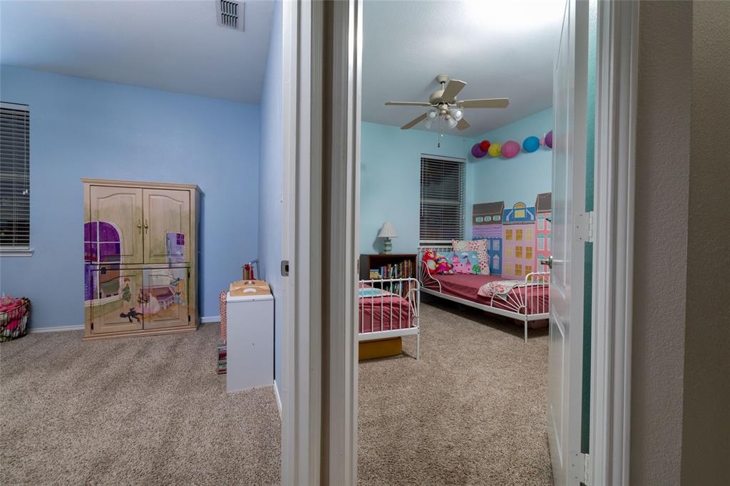 4025 Chisos Rim Trail Fort Worth, TX 76244 - Photo 31 of 40 Carpeted interior space with light blue walls and a window with blinds